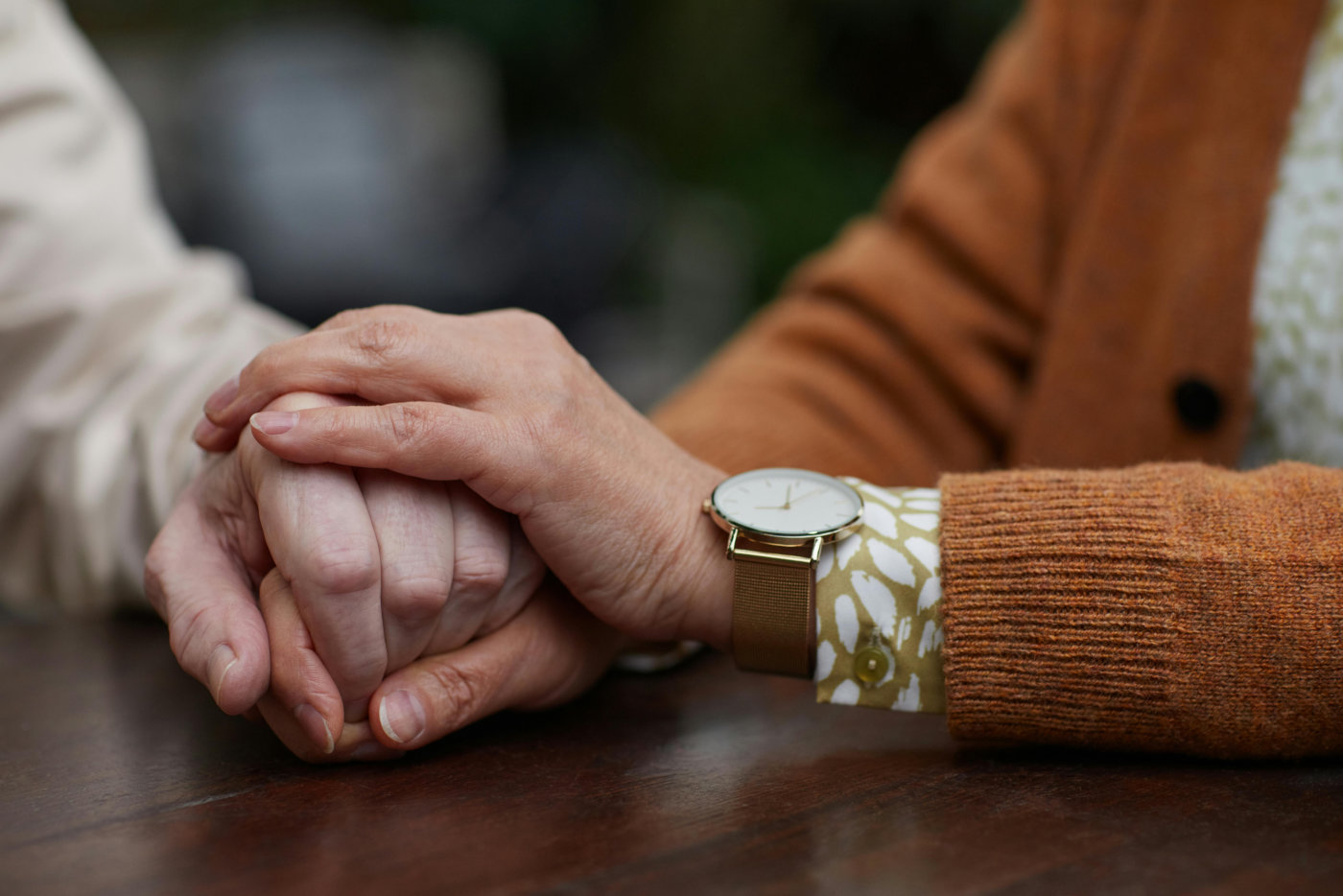 Senior holding hands