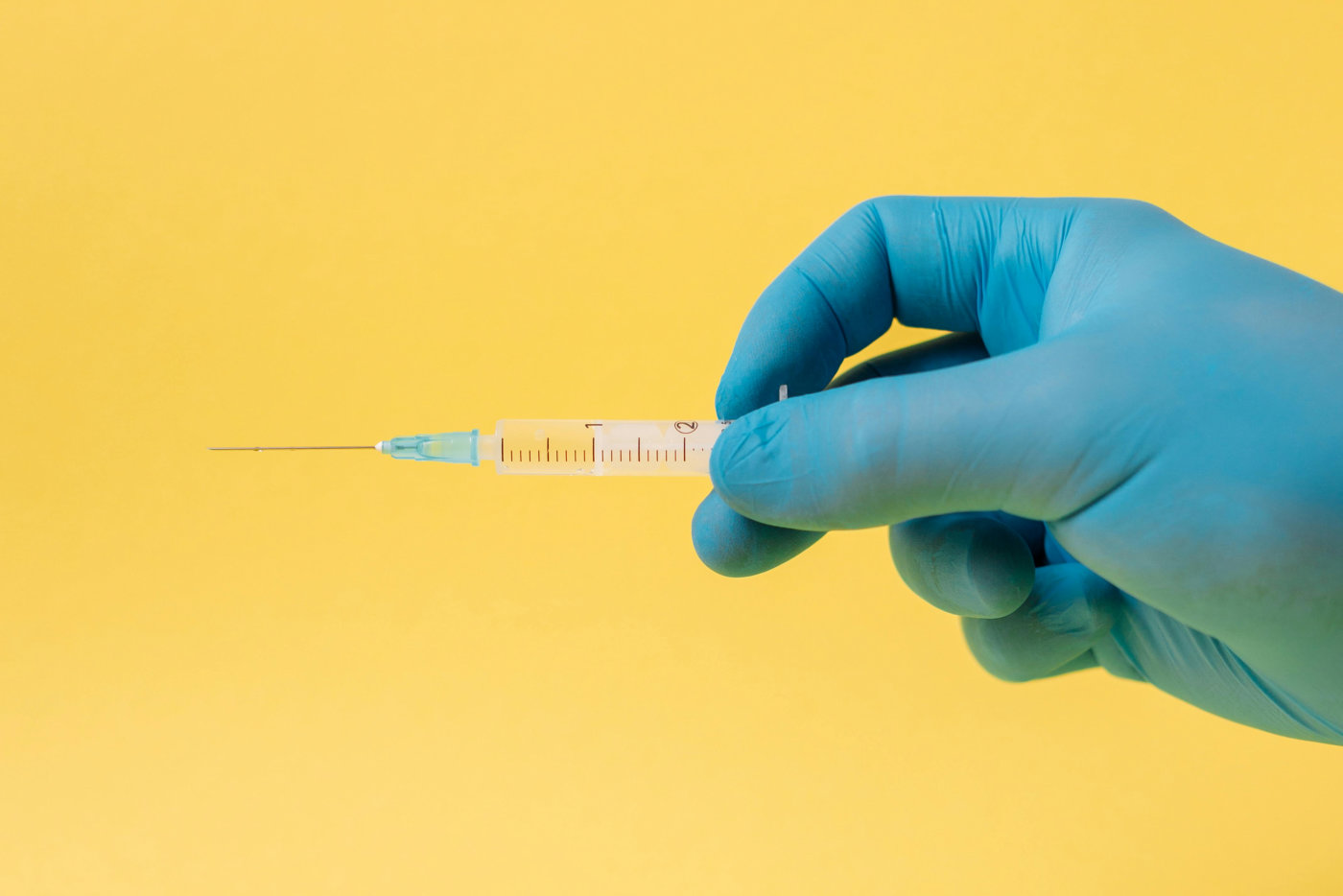 Person Holding A Syringe