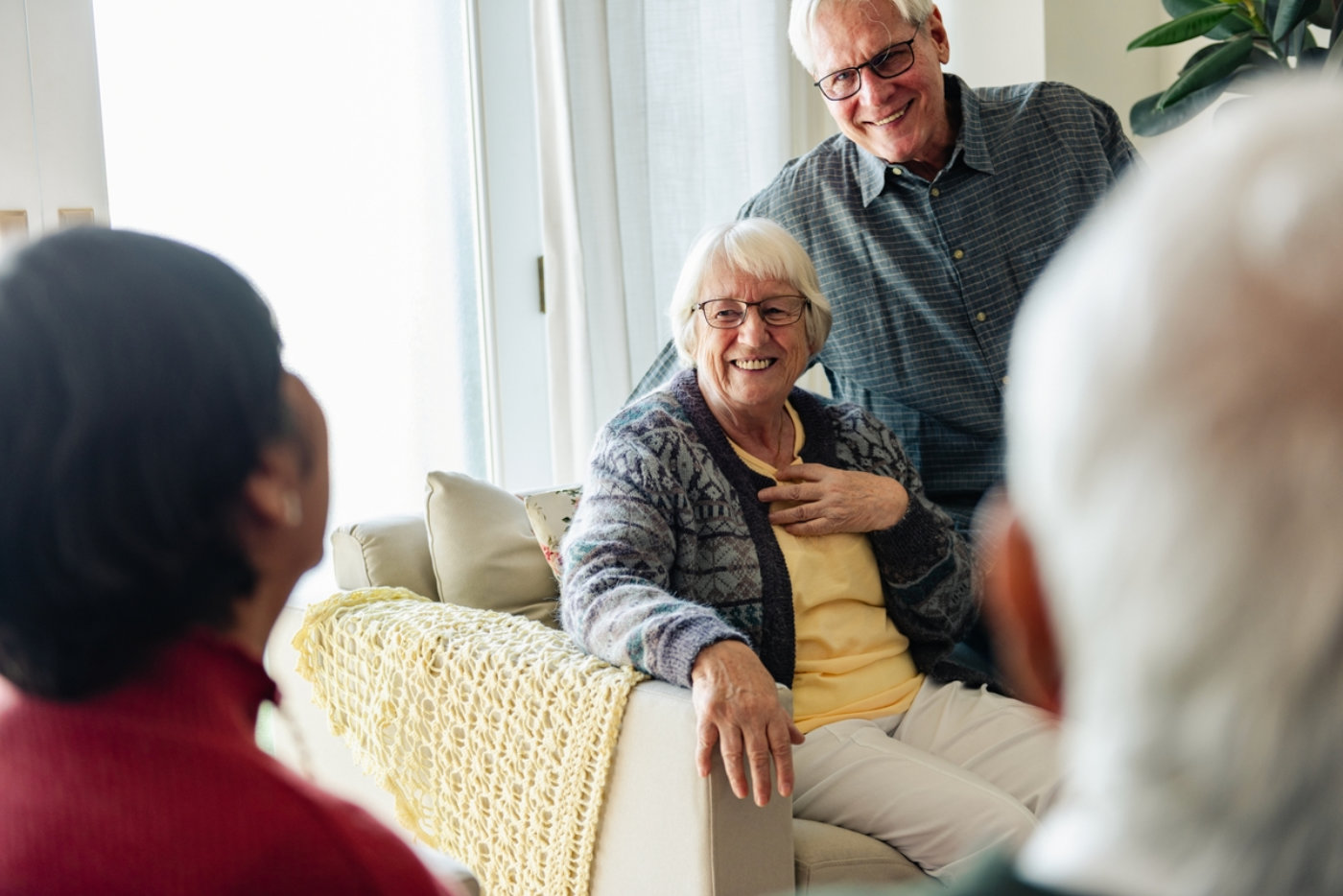 Enjoying a conversation in a cozy living room.